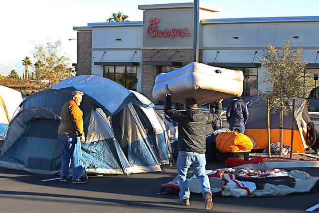 Paul Missimer, left, and Nick Luers, both of Henderson, set up their tent outside Chick-fil-A in Henderson Wednesday, Jan. 25, 2017. Hardcore fans camp outside the restaurant for the chance to win ...