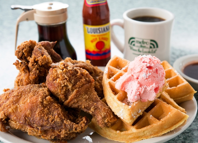 Fried chicken and a Belgian waffle topped with strawberry butter is one of Metro Diner's breakfast items. (Metro Diner)
