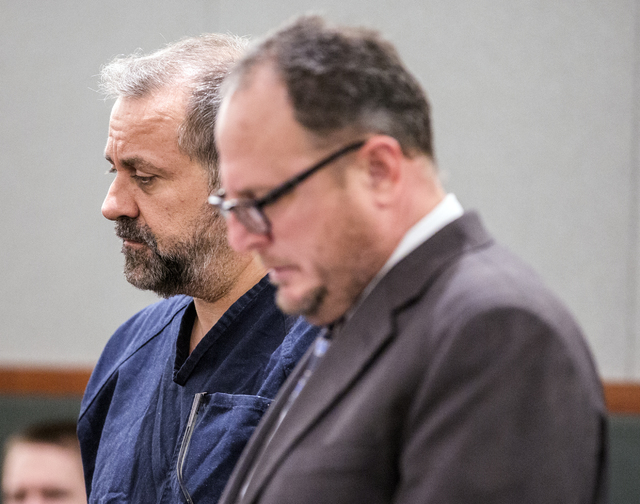 Suspended probate lawyer Robert Graham, left, confers with his attorney Bryan Cox while making his first court appearance at Regional Justice Center on Tuesday, Jan. 10, 2017. He is charged in ste ...