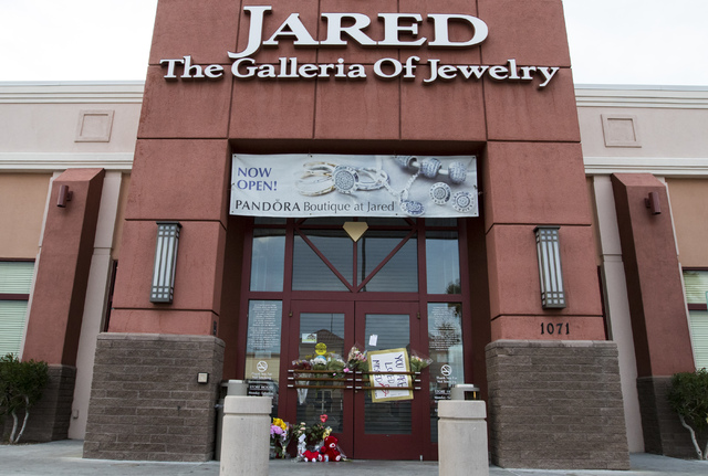 A memorial display in front of Jared, a jewelry store where employee Kimberlee Ann Kincaid-Hill died after being accidentally shot by a security guard during an armed robbery at the store in Hende ...