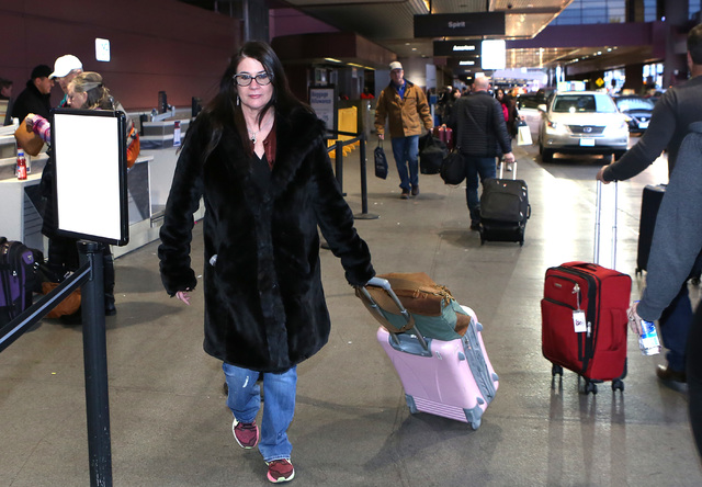 Claudia Keelan arrives at McCarran International Airport on Thursday, Jan. 19, 2017, in Las Vegas. Keelan departs for  District of Columbia to participate in the Women's March in Washington. (Bizu ...