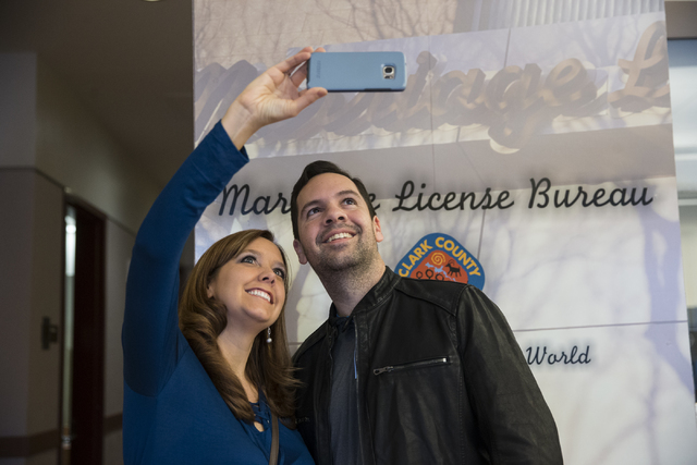 Brittney McDaniel, left, and Terry Sleister of Georgia take a photo after completing their marriage license at the Clark County Marriage License Bureau on Friday, Jan. 13, 2017, in Las Vegas. Erik ...