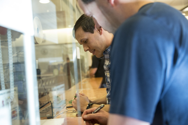 Chad Swiney, left, and Greg Anderson of Tennessee complete their marriage license at the Clark County Marriage License Bureau on Friday, Jan. 13, 2017, in Las Vegas. Erik Verduzco/Las Vegas Review ...