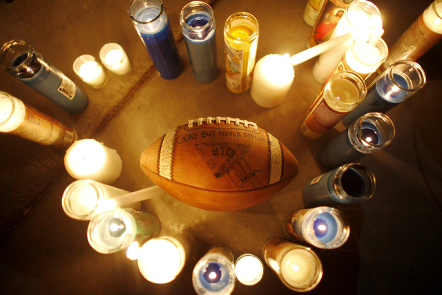 A football that people passed around and signed at a vigil in honor of Richard Nelson on Sunday, Jan. 15, 2017, at Chaparral High School in Las Vegas. Nelson was shot and killed Saturday night in ...