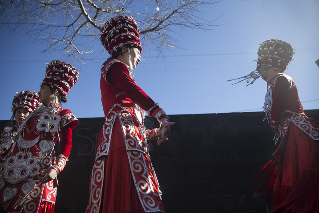 Members of the Sichuan Song and Dance Theater Company who declined to give their names wait to perform during the Chinese New Year in the Desert event at the Container Park on Saturday, Jan. 28, 2 ...