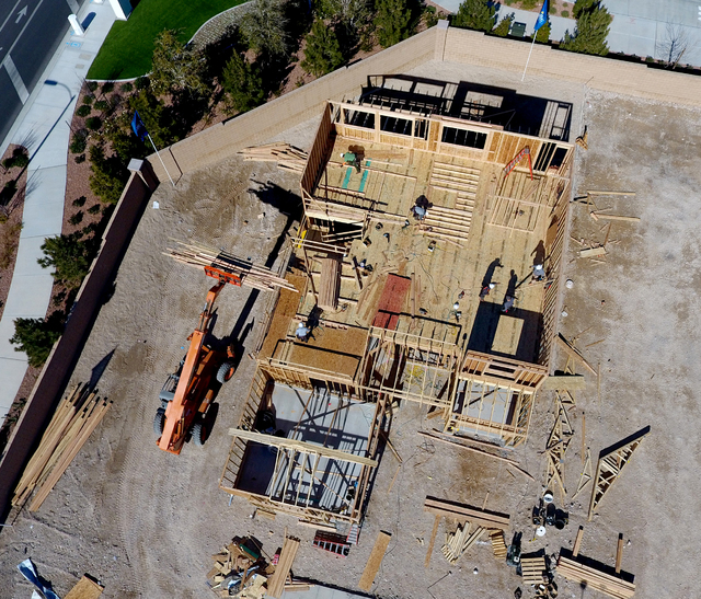 Aerial view of a construction crew working to complete a home in the Skye Canyon housing development in northwest Las Vegas on Wednesday, January 26, 2017. (Michael Quine/Las Vegas Review-Journal) ...
