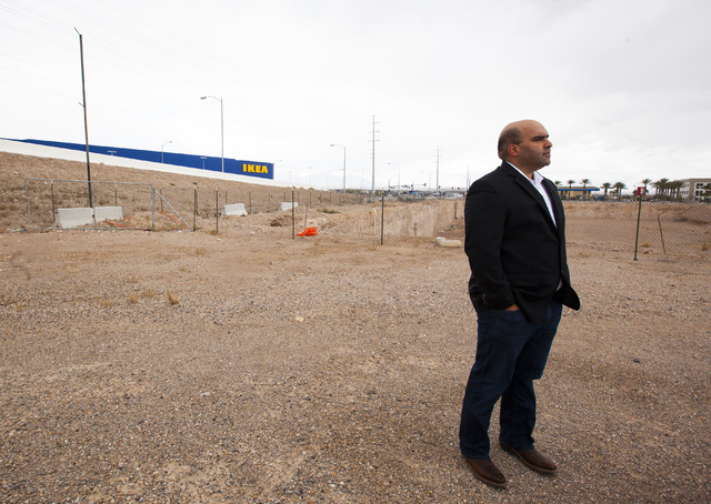 Listing broker Aman Lal speaks to a reporter explore about a plot of land at the southeast corner of Sunset Road and Durango Drive that has been vacant since 2008 in Las Vegas on Thursday, Jan. 19 ...