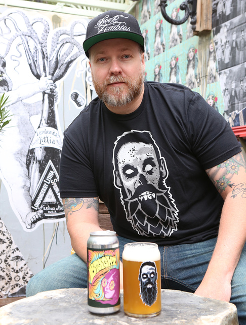 Chris Jacobs with the mural he created at Park on Fremont, and with his craft Beer and Zombies glassware on Thursday, Jan. 19, 2017, in Las Vegas. (Bizuayehu Tesfaye/Las Vegas Review-Journal) @biz ...