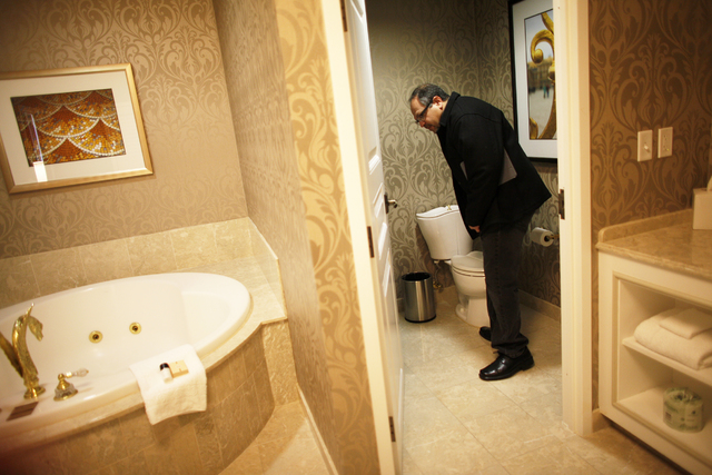 Leonard Bergman checks the toilet on Monday, Jan. 23, 2017 in a newly  renovated room at the Paris hotel-casino. (Rachel Aston/Las Vegas  Review-Journal) @rookie__rae