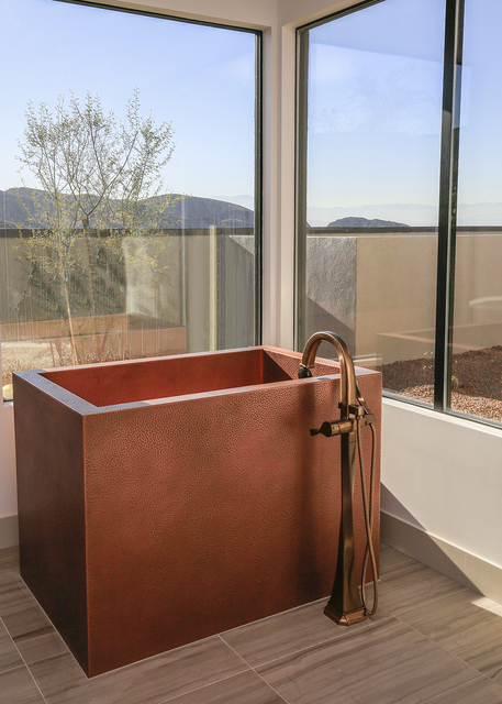 The master bath's large copper Japanese soaking tub. (Elke Cote/Real Estate Millions)