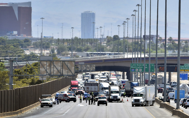 Las Vegas police investigate a fatal crash involving a motorcycle on northbound Interstate 15 just south of Cheyenne Avenue on June 23, 2015. (David Becker/Las Vegas Review-Journal)