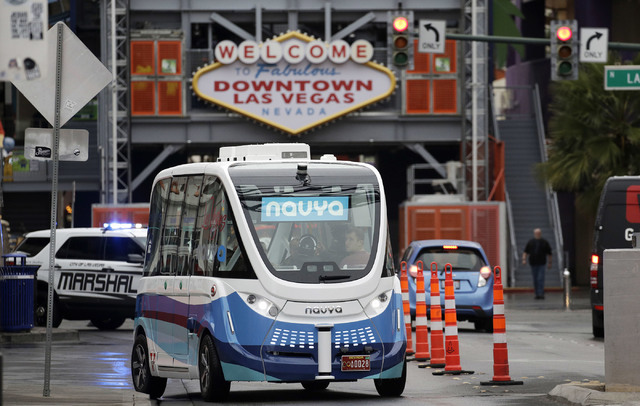 In this Jan. 12, 2017, photo, the Navya Arma autonomous vehicle drives down a street  in Las Vegas. The driverless electric shuttle has begun carrying passengers in a test program in a downtown La ...