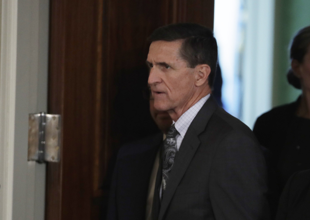 National Security Adviser Michael Flynn in the East Room of the White House in Washington, Monday, Feb. 13, 2017, for a joint news conference with President Donald Trump and Canadian Prime Ministe ...