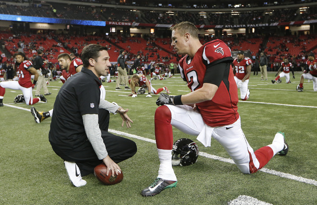 In this Dec. 4, 2016, file photo, Atlanta Falcons quarterback Matt Ryan (2) speaks with offensive coordinator Kyle Shanahan before the start of an NFL football game against the Kansas City Chiefs, ...