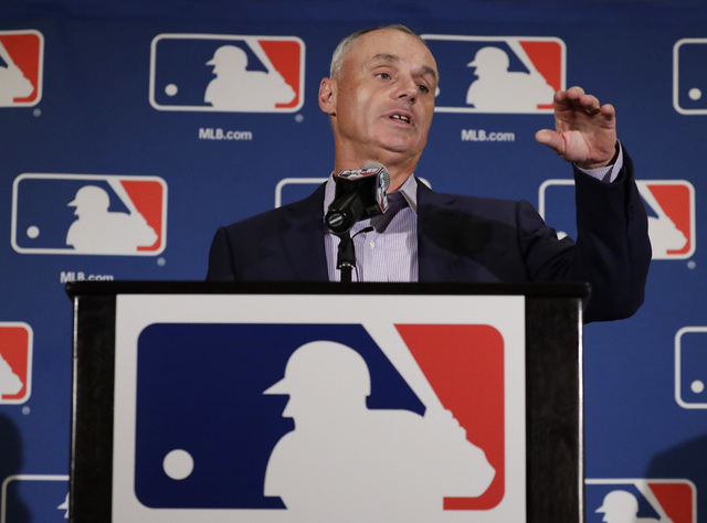 Major League Baseball Commissioner Rob Manfred answers questions at a news conference Tuesday, Feb. 21, 2017, in Phoenix. (Morry Gash/AP)