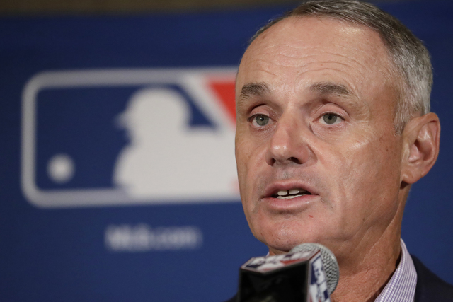Major League Baseball Commissioner Rob Manfred answers questions at a news conference Tuesday, Feb. 21, 2017, in Phoenix. (Morry Gash/AP)