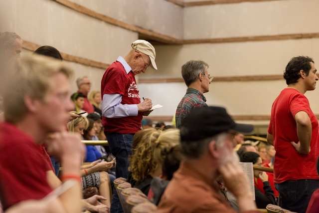 Howard Booth, 90, center, has been fighting for Red Rock for  55 years, goes over his testimony that he will give against the proposed development of 5,025 homes on Blue Diamond Hill to the County ...