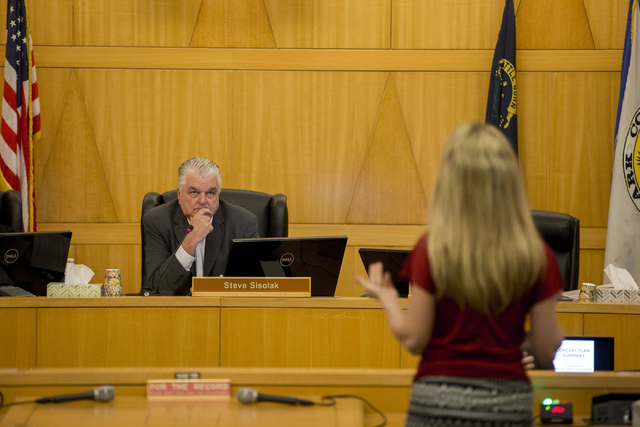Steve Sisolak, County Commissioner chairman, listens to Heather Fisher, president of Save Red Rock, testify against the potential Blue Diamond Hill development, Wednesday, Feb. 22, 2017 at the Cla ...