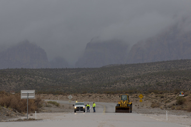 A portion of Blue Diamond Rd, leading to Red Rock Canyon's scenic loop, was closed due to flooding Saturday, Feb. 18, 2017, in Las Vegas. On Friday a flash-flood watch for Southern Nevada that wil ...
