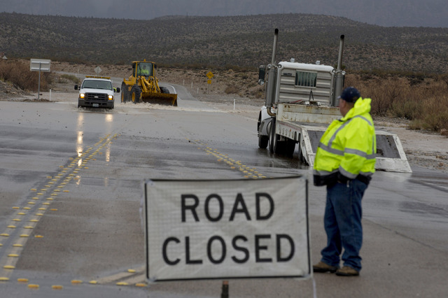 A portion of Blue Diamond Rd, leading to Red Rock Canyon's scenic loop, was closed due to flooding Saturday, Feb. 18, 2017, in Las Vegas. On Friday a flash-flood watch for Southern Nevada that wil ...