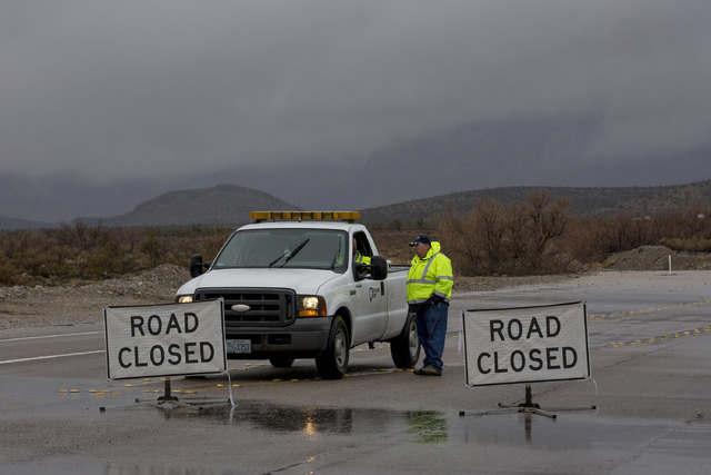 A portion of Blue Diamond Rd, leading to Red Rock Canyon's scenic loop, was closed due to flooding Saturday, Feb. 18, 2017, in Las Vegas. On Friday a flash-flood watch for Southern Nevada that wil ...