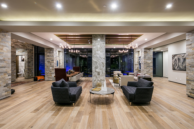 The home features Siberian oak-plank floors and stacked stones. (Courtesy)