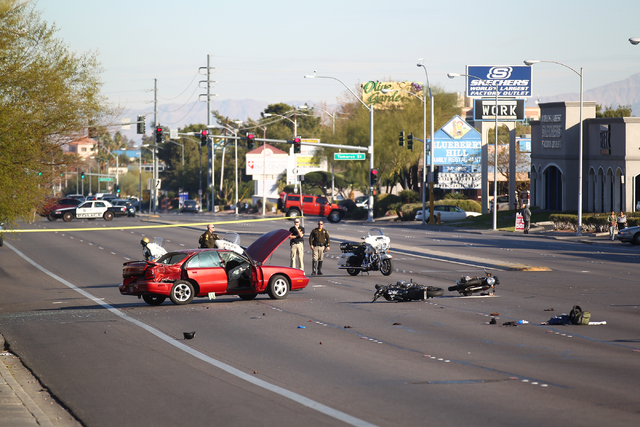 Las Vegas police respond to the scene of a crash involving two motorcycles and one car on Flamingo Road near Maryland Parkway in Las Vegas on Jan. 19, 2015. (Chase Stevens/Las Vegas Review-Journal)