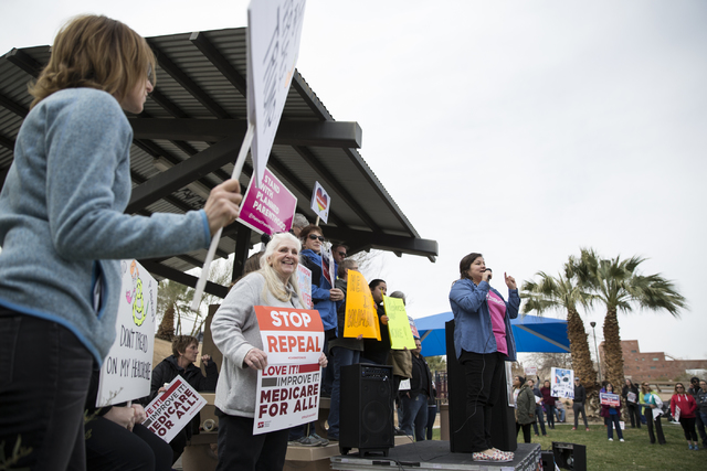 Raquel Cruz-Juarez, organizer for Planned Parenthood, speaks in front of health care advocates protesting changes to the Affordable Care Act during a rally at Heritage Park on Saturday, Feb. 25, 2 ...