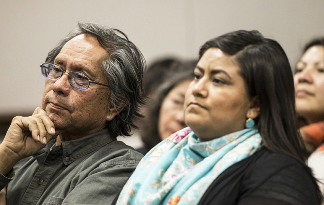 Joe Bryan, left, a member of the Washoe Tribe, listens to officials on the Senate Government Affairs Committee discuss a resolution to replace Columbus Day with Indigenous People Day at the Nevada ...