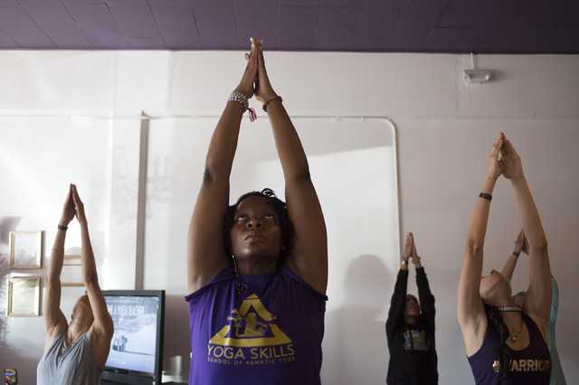 Maticia Sudah, center, organized the Kemetic yoga workshop taught by Yirser Ra Hotep at Sin City Yoga on February 4 and 5. Ra Hotep trained Sudah as a Kemetic yoga instructor. (Bridget Bennett/Las ...