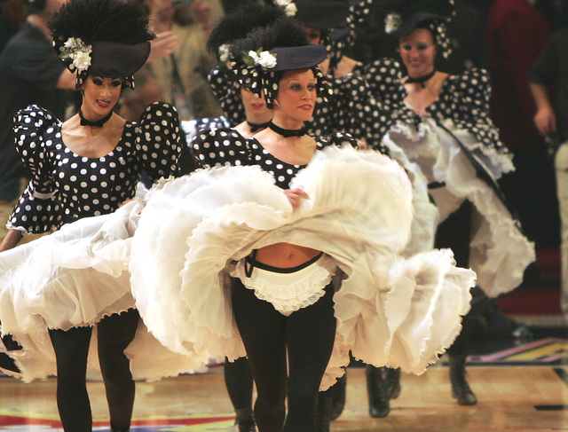 Dancers from the Folies Bergere show at theTropicana hotel-casino perform during a time out on Sunday, Feb. 18, 2007 during the All-Star basketball game at the Thomas and Mack Center in Las Vegas. ...