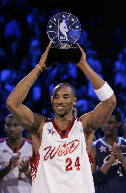 Kobe Bryant holds up the MVP trophy during the NBA All-Star game at the Thomas & Mack Center in Las Vegas Sunday, Feb. 18, 2007. (John Locher/Las Vegas Review-Journal)