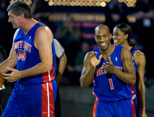 Team Detroit, from left, NBA legend Bill Laimbeer, WNBA player Swin Cash and current Detroit Pistons player Chauncey Billups celebrate Billups sinking a half court shot in the Shooting Stars compe ...