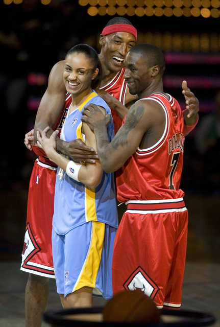Team Chicago, from left, Chicago Sky of the WNBA player Candace Dupree, NBA legend Scottie Pippen and current Chicago Bulls player Ben Gordon celebrate winning the first round of the Shooting Star ...