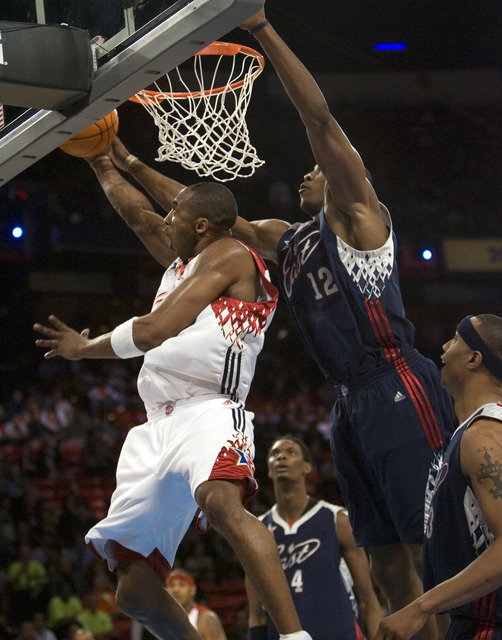 West guard Kobe Bryant of the Los Angeles Lakers shoots a reverse layup past Dwight Howard of Orlando during the NBA All-Star Game at the Thomas & Mack Center Sunday, Feb. 18, 2007. (K.M. Cann ...