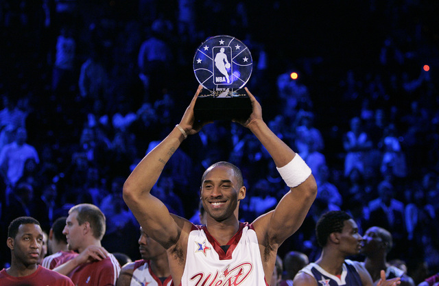 Kobe Bryant holds up the MVP trophy during the NBA All-Star game at the Thomas & Mack Center in Las Vegas Sunday, Feb. 18, 2007. (John Locher/Las Vegas Review-Journal)