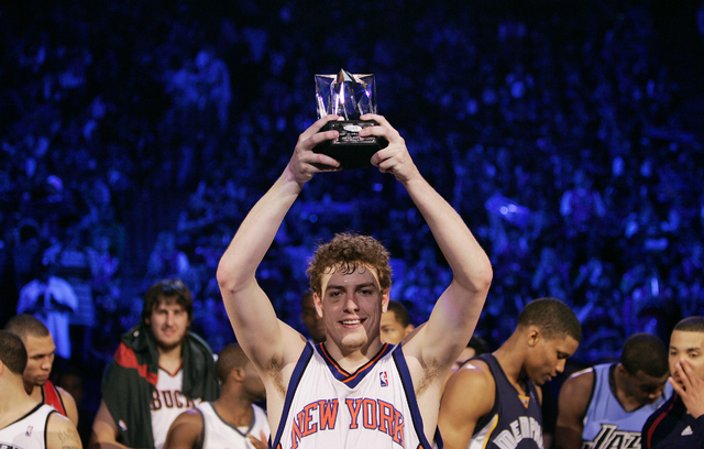 David Lee of the Sophomore team holds up the MVP trophy after the NBA All-Star Rookie Challenge basketball game at the Thomas & Mack Center in Las Vegas Saturday, Feb. 16, 2007. (John Locher/L ...