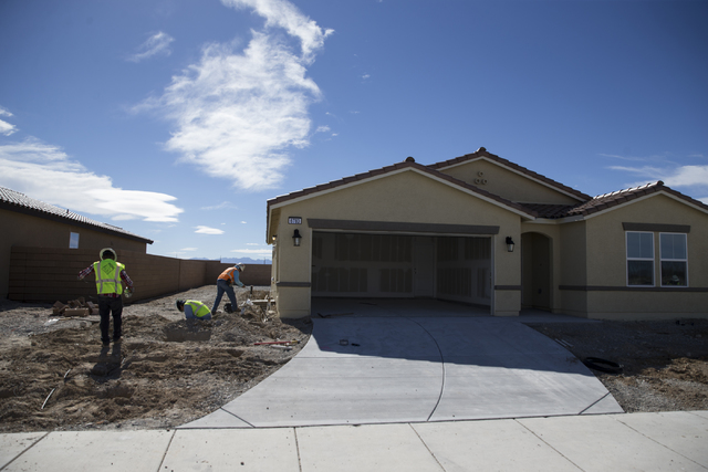 Workers finish homes at the Burson Ranch community by Beazer Homes, Thursday, Feb. 16, 2017, in Pahrump, Nev. (Erik Verduzco/Las Vegas Review-Journal) @Erik_Verduzco
