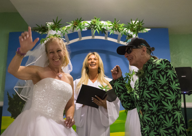Venus Heard, left, and Jon Rothberg, both of Mesa, Arizona, celebrate at the conclusion of their wedding ceremony at The Cannabis Chapel in downtown Las Vegas on Friday, Feb. 3, 2017. Officiant Ti ...