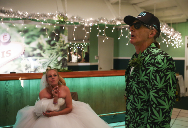 Jon Rothberg of Mesa, Arizona, talks before his wedding ceremony with Venus Heard of Mesa, Ariz. relaxes in The Cannabis Chapel before her wedding ceremony in downtown Las Vegas on Friday, Feb. 3, ...
