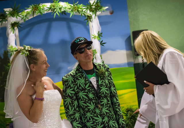 Venus Heard, left, and Jon Rothberg, both of Mesa, Arizona, at the conclusion of their wedding ceremony at The Cannabis Chapel in downtown Las Vegas on Friday, Feb. 3, 2017. Officiant Tiffany Whit ...