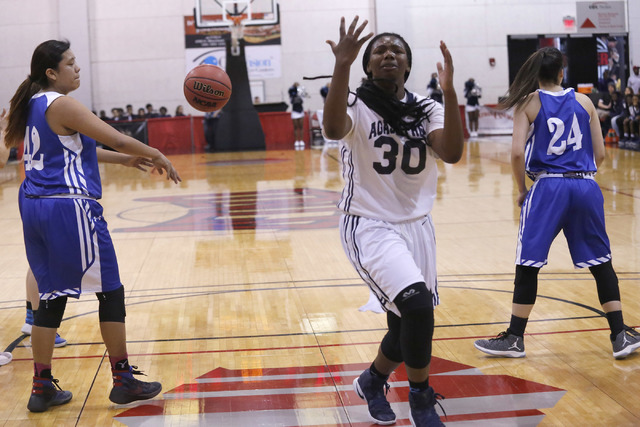 Agassi Prep's Sharmayne Finley (30) reacts after the ball is knocked from her hands during the first half of a Class 2A girls state final championship game at the Cox Pavilion on Saturday, Feb. 25 ...