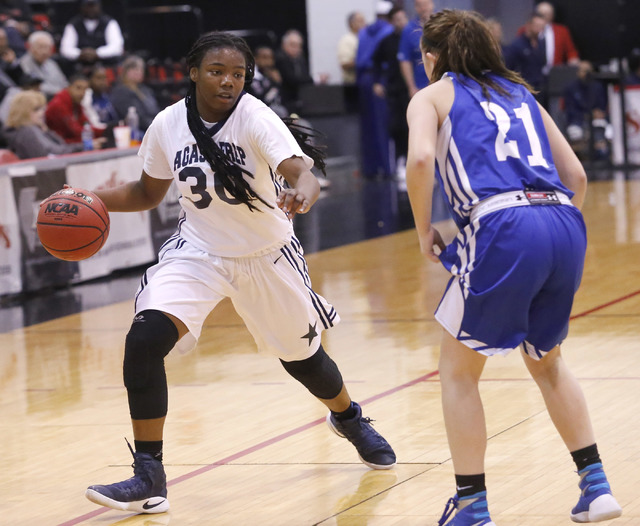 Agassi Prep's J'Laiya Regan (3) dribbles pass Needle's Preslee Murch (21) during the first half of a Class 2A girls state final championship game at the Cox Pavilion on Saturday, Feb. 25, 2017, in ...
