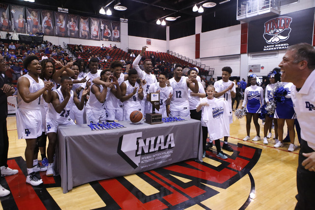 Desert Pines players react after winning a Class 3A boys state final championship game at the Cox Pavillion on Saturday, Feb. 25, 2017, in Las Vegas. Desert Pine won 69-46. (Christian K. Lee/Las V ...