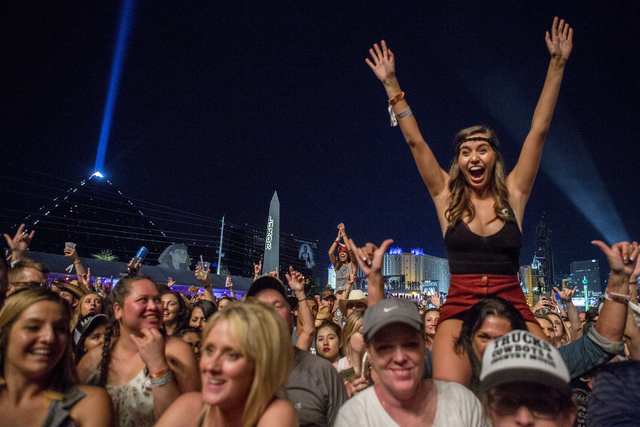 The crowd cheers as Chris Young performs during the second night of Route 91 Harvest country music festival at the MGM Resorts Village festival site in Las Vegas on Saturday, Oct. 1, 2016. Elizabe ...