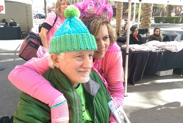 Clem Wiechecki, 75, poses with his wife Debbie, 57, before the "Scale the Strat: Fight for Air" event begins. (Brooke Wanser/Las Vegas Review-Journal)