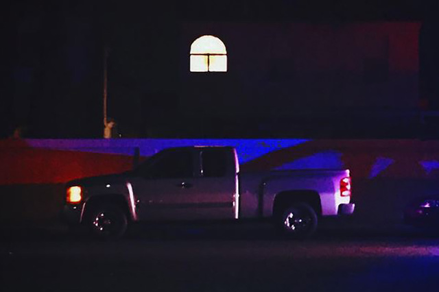 A single upstairs bedroom light remains on in a northwest valley home where a couple died in a murder-suicide on March 7, 2016. (Rachel Crosby/Las Vegas Review-Journal)