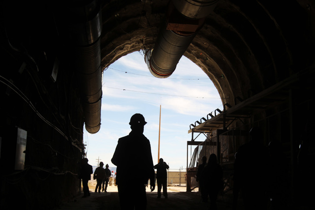 Congressmen's staff, journalists and Department of Energy employees explore the north portal during a congressional tour of the Yucca Mountain exploratory tunnel Thursday, April 9, 2015. (Sam Morr ...