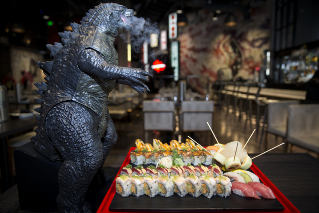 The Godzilla Platter, served with five different sushi rolls that include the tempura roll, tiger roll, girl on the beach roll, el chapo roll, and rok & roll, and four type of nigiri that incl ...