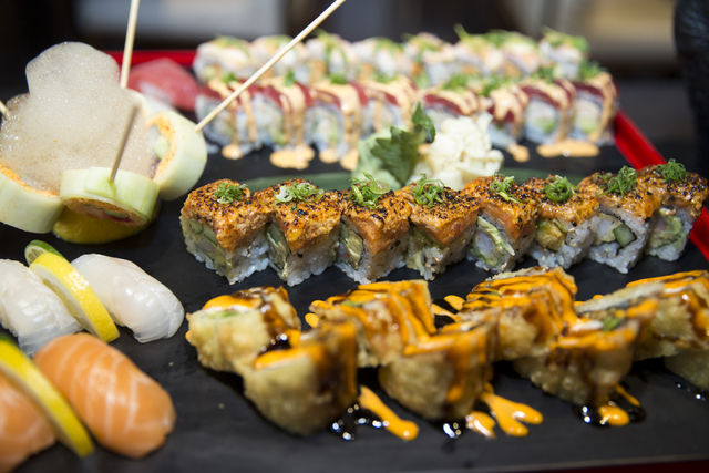 The Godzilla Platter, served with five different sushi rolls that include the tempura roll, tiger roll, girl on the beach roll, el chapo roll, and rok & roll, and four type of nigiri that incl ...